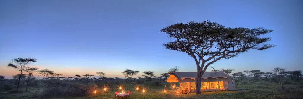 Serengeti tented camp at dusk on a Tanzania luxury safari